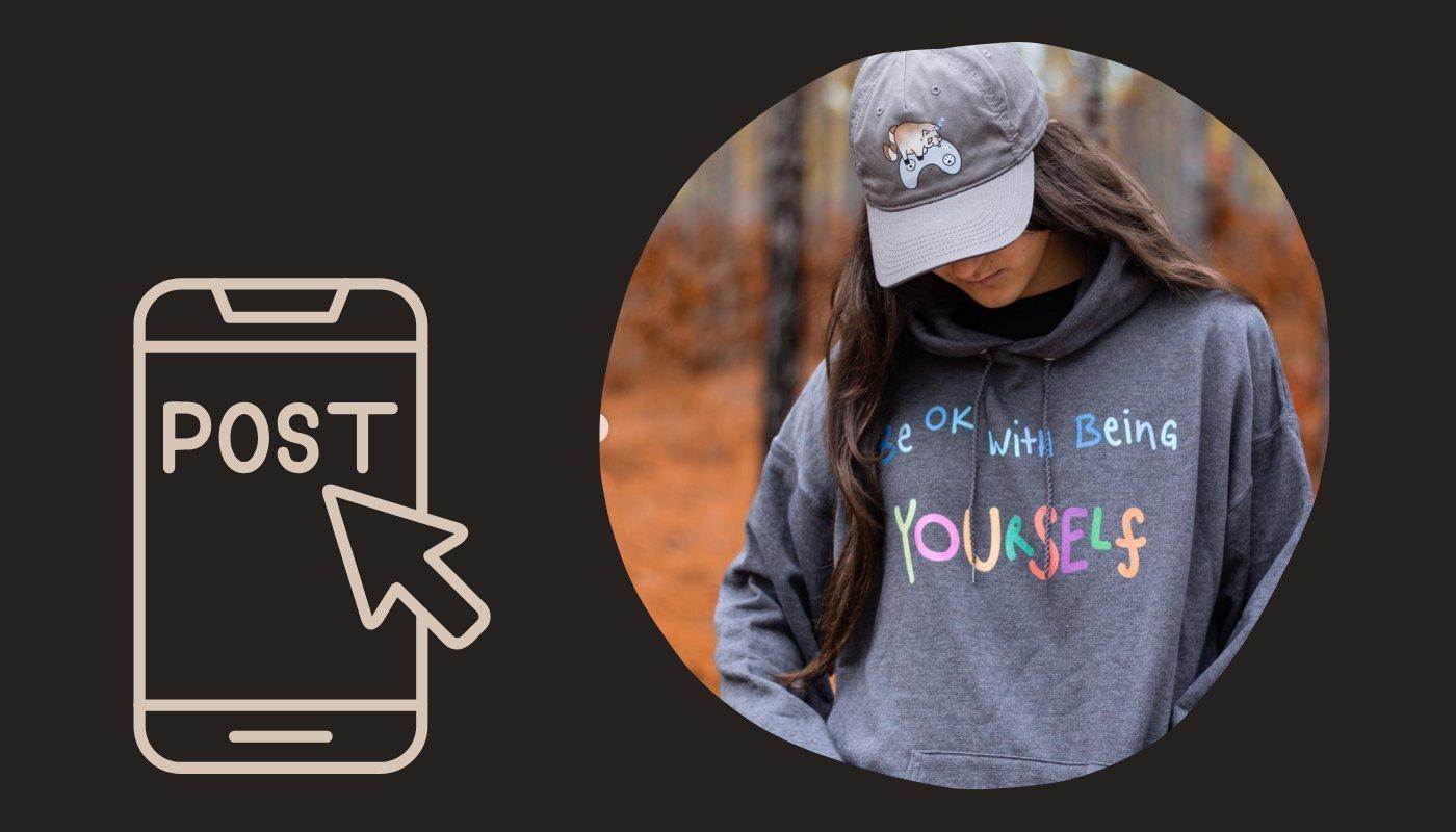 content creator wearing a custom hoodie to illustrate posting strategy for merch